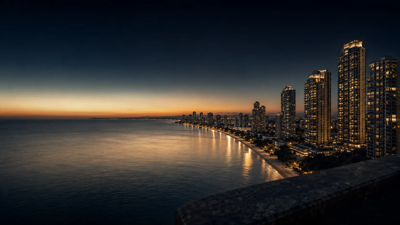 View over Pattaya Bay at sunset with high-rise towers